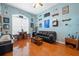 Inviting living room featuring a shuffleboard table, wet bar, and comfortable seating, perfect for entertaining guests at 5351 Championship Cup Ln, Spring Hill, FL 34609