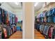 Spacious walk-in closet with ample storage space for clothes, shoes, and accessories at 5351 Championship Cup Ln, Spring Hill, FL 34609