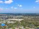Scenic aerial view showcasing the expansive community, nearby cityscape, and lush greenery at 5412 Hammock View Ln, Apollo Beach, FL 33572
