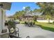 Spacious backyard featuring a patio area with an outdoor dining set, perfect for enjoying al fresco meals at 5412 Hammock View Ln, Apollo Beach, FL 33572