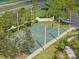Community basketball court and surrounding landscaping provides space for active recreation at 5412 Hammock View Ln, Apollo Beach, FL 33572
