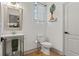 Clean and modern half-bath with pedestal sink and neutral decor at 5412 Hammock View Ln, Apollo Beach, FL 33572