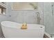 Modern bathtub with stylish faucet and tilework, a relaxing oasis at 5412 Hammock View Ln, Apollo Beach, FL 33572