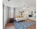 Bedroom featuring a daybed, window nook and blue patterned rug at 5412 Hammock View Ln, Apollo Beach, FL 33572