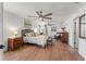 Spacious bedroom with wood-look floors, neutral paint, and ample natural light at 5412 Hammock View Ln, Apollo Beach, FL 33572
