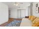 Bright bedroom featuring a daybed, window nook and blue patterned rug at 5412 Hammock View Ln, Apollo Beach, FL 33572