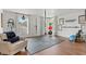 Versatile bonus room/gym with ample natural light and exercise equipment at 5412 Hammock View Ln, Apollo Beach, FL 33572