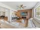 The large living room boasts an open floor plan, fireplace, and bar, perfect for entertaining at 5412 Hammock View Ln, Apollo Beach, FL 33572