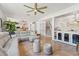 Open floor plan connects living area, stairs, and wet bar for a versatile living space at 5412 Hammock View Ln, Apollo Beach, FL 33572