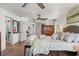 Spacious bedroom featuring hardwood floors, a ceiling fan, and natural light at 5412 Hammock View Ln, Apollo Beach, FL 33572