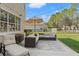 Relaxing patio area with comfortable seating and shade, ideal for outdoor entertaining and enjoying the backyard at 5412 Hammock View Ln, Apollo Beach, FL 33572