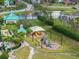 Playground with slides and climbing equipment near the water, perfect for Gathering fun in the community at 5412 Hammock View Ln, Apollo Beach, FL 33572