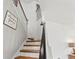 Stairway with wood treads, white risers, and decorative 'Amazing Grace' sign at 5412 Hammock View Ln, Apollo Beach, FL 33572