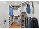 Organized walk-in closet with shelves and hanging rods for ample storage space at 5412 Hammock View Ln, Apollo Beach, FL 33572