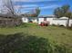 Expansive backyard with ample green space and a shed at 5900 Beech St, Zephyrhills, FL 33542