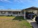 Charming single-story home with covered carport and well-maintained front yard at 5900 Beech St, Zephyrhills, FL 33542