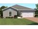 Charming one-story home featuring a two-car garage and well-manicured landscaping at 621 171St E St, Bradenton, FL 34212