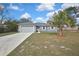 Well-maintained home featuring a fresh exterior, attached garage, and nicely sized front yard at 7399 Skylark Dr, Spring Hill, FL 34606