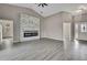 Bright living room featuring vaulted ceiling, modern fireplace, and entry foyer at 7399 Skylark Dr, Spring Hill, FL 34606