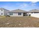 Expansive backyard with a white vinyl fence and newly planted lawn at 7552 Gardner St, Brooksville, FL 34613