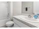 Modern bathroom features a vanity with solid surface countertop and shower at 7552 Gardner St, Brooksville, FL 34613