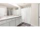 Bright bathroom featuring a double sink vanity, shower, and a toilet at 7552 Gardner St, Brooksville, FL 34613