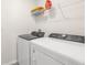 Clean laundry room includes a washer and dryer at 7552 Gardner St, Brooksville, FL 34613
