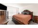 Comfortable main bedroom with a beautiful wood bed frame and matching dresser at 7552 Gardner St, Brooksville, FL 34613