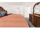 Comfortable main bedroom with a beautiful wood bed frame and matching dresser at 7552 Gardner St, Brooksville, FL 34613