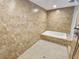 Large bathroom with a tub and fully tiled walls at 8055 River Country Dr, Weeki Wachee, FL 34607