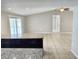 Open concept kitchen bar area looking out to the rest of the home and backyard pool area at 8055 River Country Dr, Weeki Wachee, FL 34607