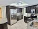 Modern kitchen with stainless steel appliances and a large refrigerator at 8055 River Country Dr, Weeki Wachee, FL 34607