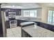 Updated kitchen featuring granite countertops, stainless steel appliances, and a bright, open layout at 8055 River Country Dr, Weeki Wachee, FL 34607