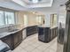Large kitchen with granite countertops and stainless steel appliances at 8055 River Country Dr, Weeki Wachee, FL 34607
