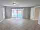 Open floor plan living room with view of the backyard pool at 8055 River Country Dr, Weeki Wachee, FL 34607