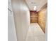 Wood planked spacious walk-in closet with custom shelving for ample storage and organization at 8055 River Country Dr, Weeki Wachee, FL 34607