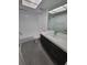 Bathroom featuring a combined tub and shower, modern vanity and a modern style faucet at 3233 Teeside Dr, New Port Richey, FL 34655