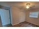 Bright bedroom features wood-look floors, ceiling fan and a window at 3233 Teeside Dr, New Port Richey, FL 34655