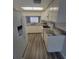Bright kitchen with stainless steel appliances, sleek countertops and ample cabinet space at 3233 Teeside Dr, New Port Richey, FL 34655