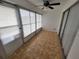 Lanai with tiled flooring and screening with vinyl windows at 3233 Teeside Dr, New Port Richey, FL 34655