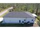 This is an aerial view of a white single-Gathering home with a screened in patio at 435 Mcdill Dr, Port Charlotte, FL 33953