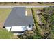 This is an aerial view of a single-Gathering home with a dark roof and white exterior at 435 Mcdill Dr, Port Charlotte, FL 33953
