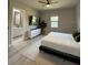 Bedroom featuring modern furnishings, a white comforter, and lots of natural light at 435 Mcdill Dr, Port Charlotte, FL 33953