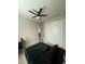Contemporary bedroom offering a sleek bed, fan, closet, and modern workspace at 435 Mcdill Dr, Port Charlotte, FL 33953
