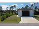 Newly constructed home with a spacious driveway and a large two-car garage at 435 Mcdill Dr, Port Charlotte, FL 33953