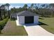 Newly constructed home with a spacious driveway and a large two-car garage at 435 Mcdill Dr, Port Charlotte, FL 33953