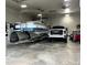 Oversized garage showcasing a boat and truck, highlighting storage and vehicle capacity at 435 Mcdill Dr, Port Charlotte, FL 33953