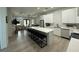Bright kitchen with large island, pendant lighting, and views into the adjacent living areas at 435 Mcdill Dr, Port Charlotte, FL 33953