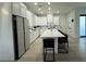 Modern kitchen with white cabinets, stainless steel appliances, and a large island with seating at 435 Mcdill Dr, Port Charlotte, FL 33953