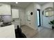 Corner view of modern kitchen with white cabinets and contrasting dark hardware at 435 Mcdill Dr, Port Charlotte, FL 33953